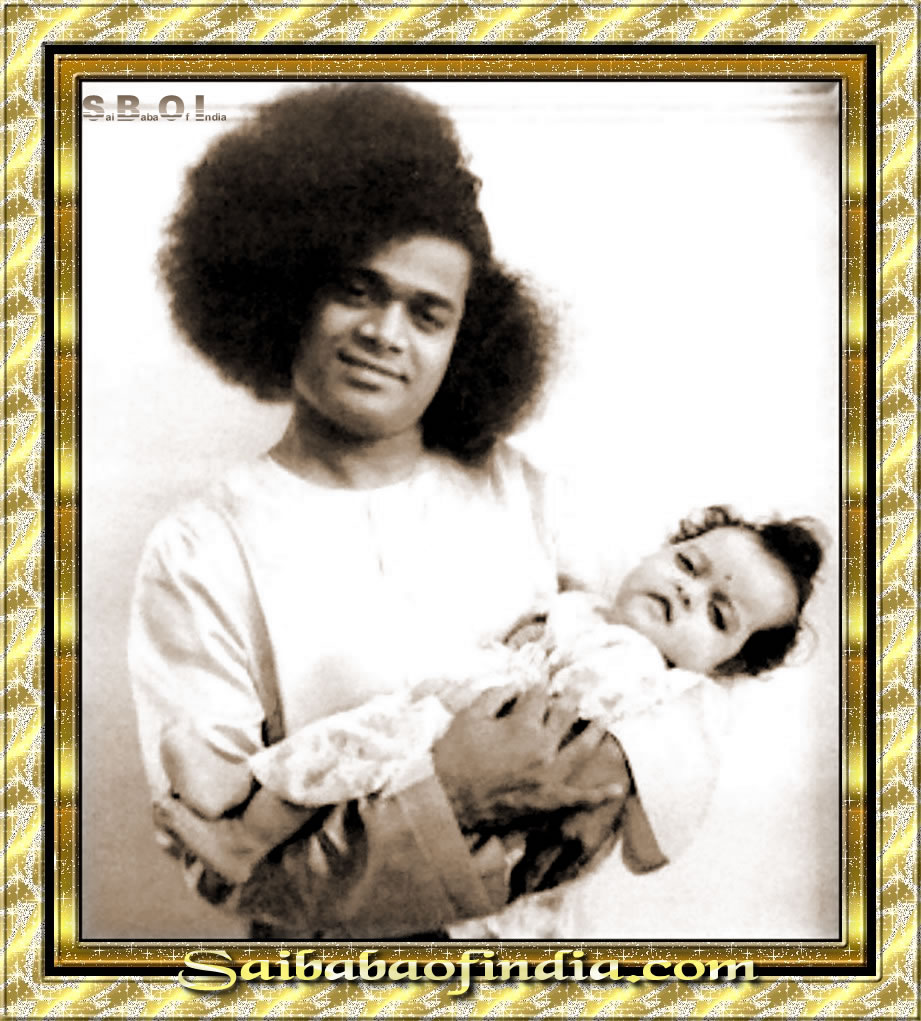 Sathya_Sai_Baba_rare_and_old_photos - Sathya-Sai-Baba-holding-a-baby