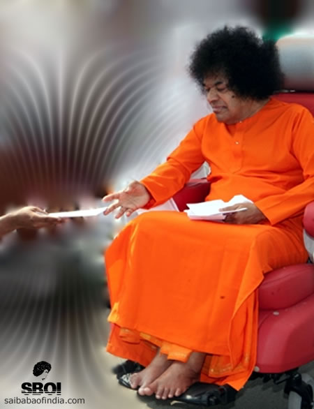 Sai Baba taking a letter from a devotee - SBOI 